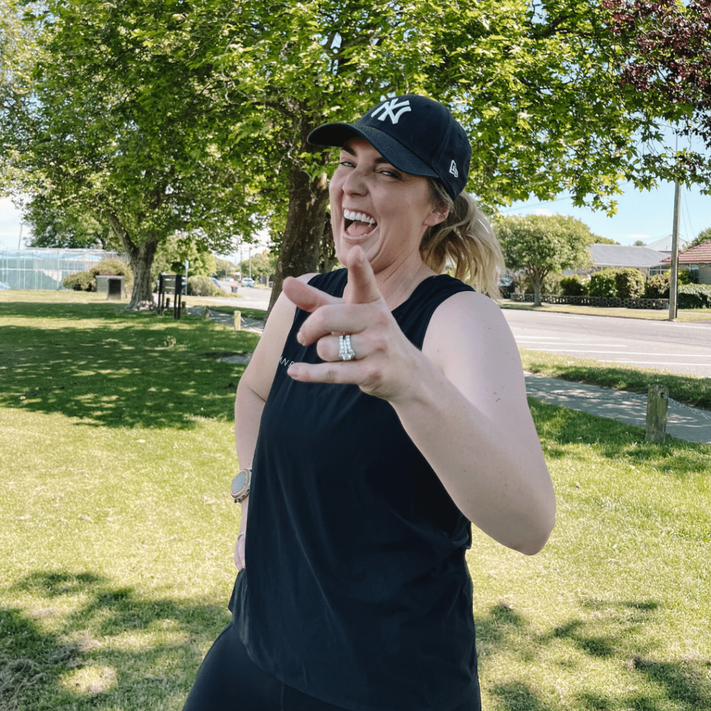 Hannah Romano Fitness coach laughing in the park